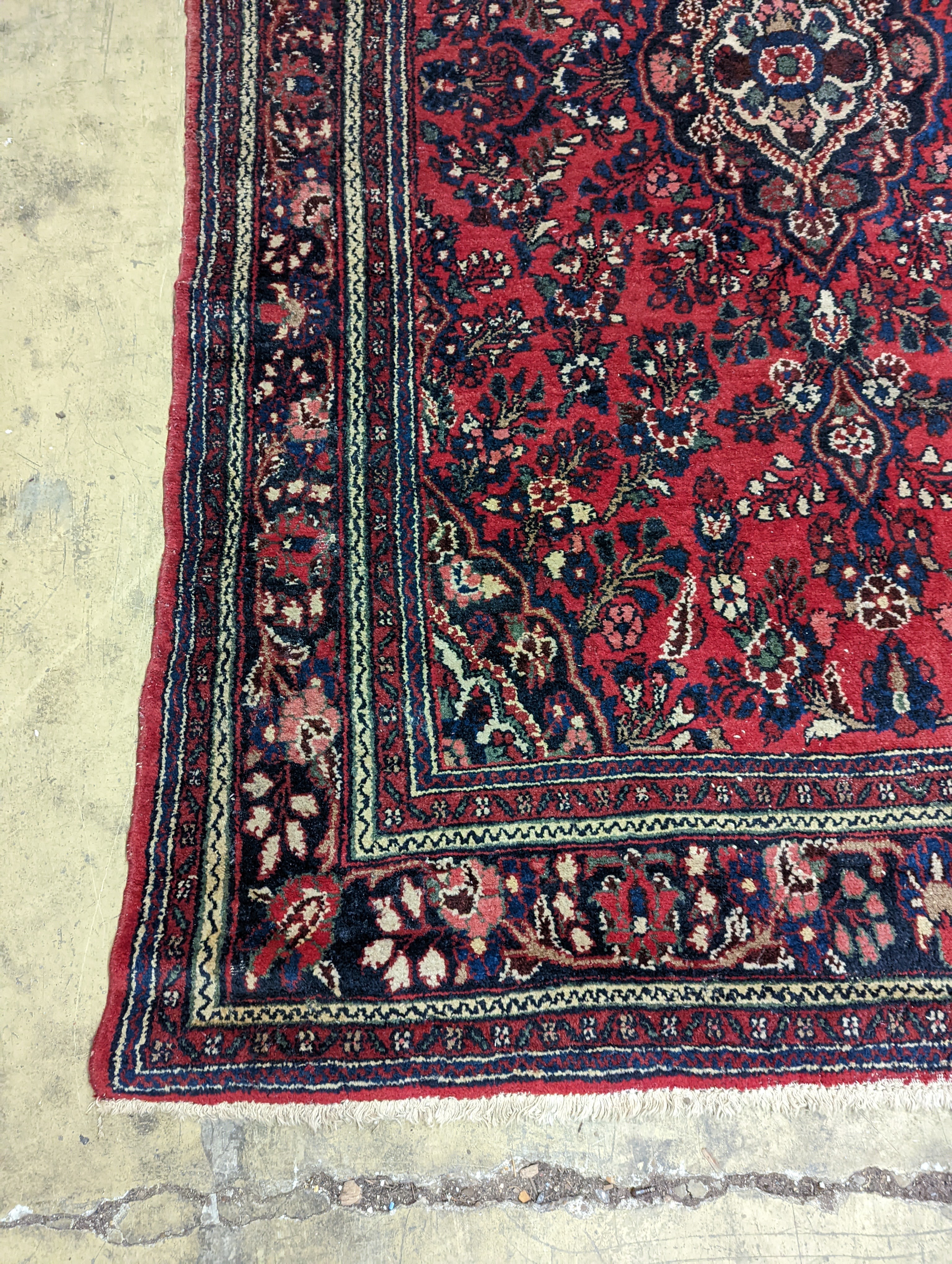 A Tabriz style red ground carpet, 290 x 190cm